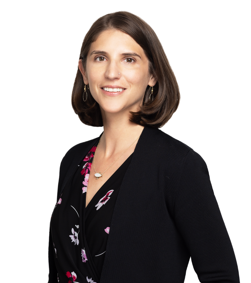 Photo of attorney Jacqueline Simonovich wearing a dark shirt and dark sweater with short brown hair.